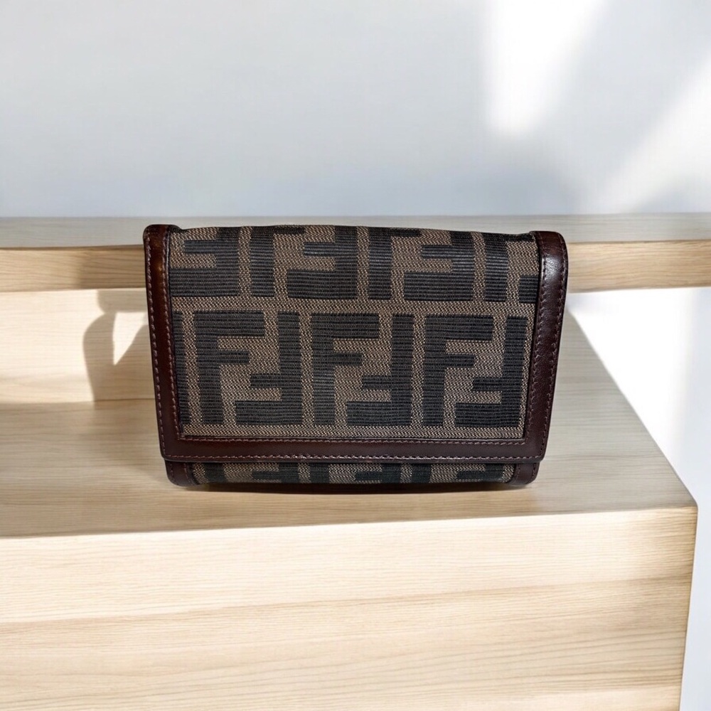 Fendi Tobacco Zuca Canvas and brown leather trim wallet.